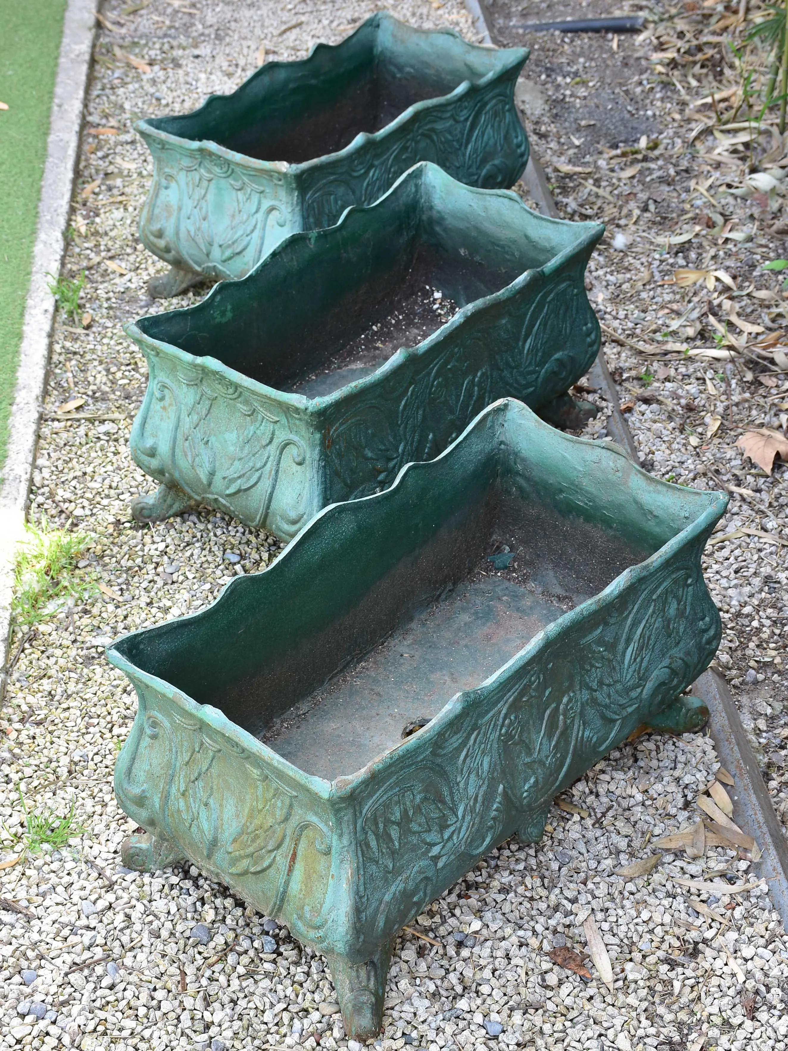 Two antique cast iron French garden planters with green finish