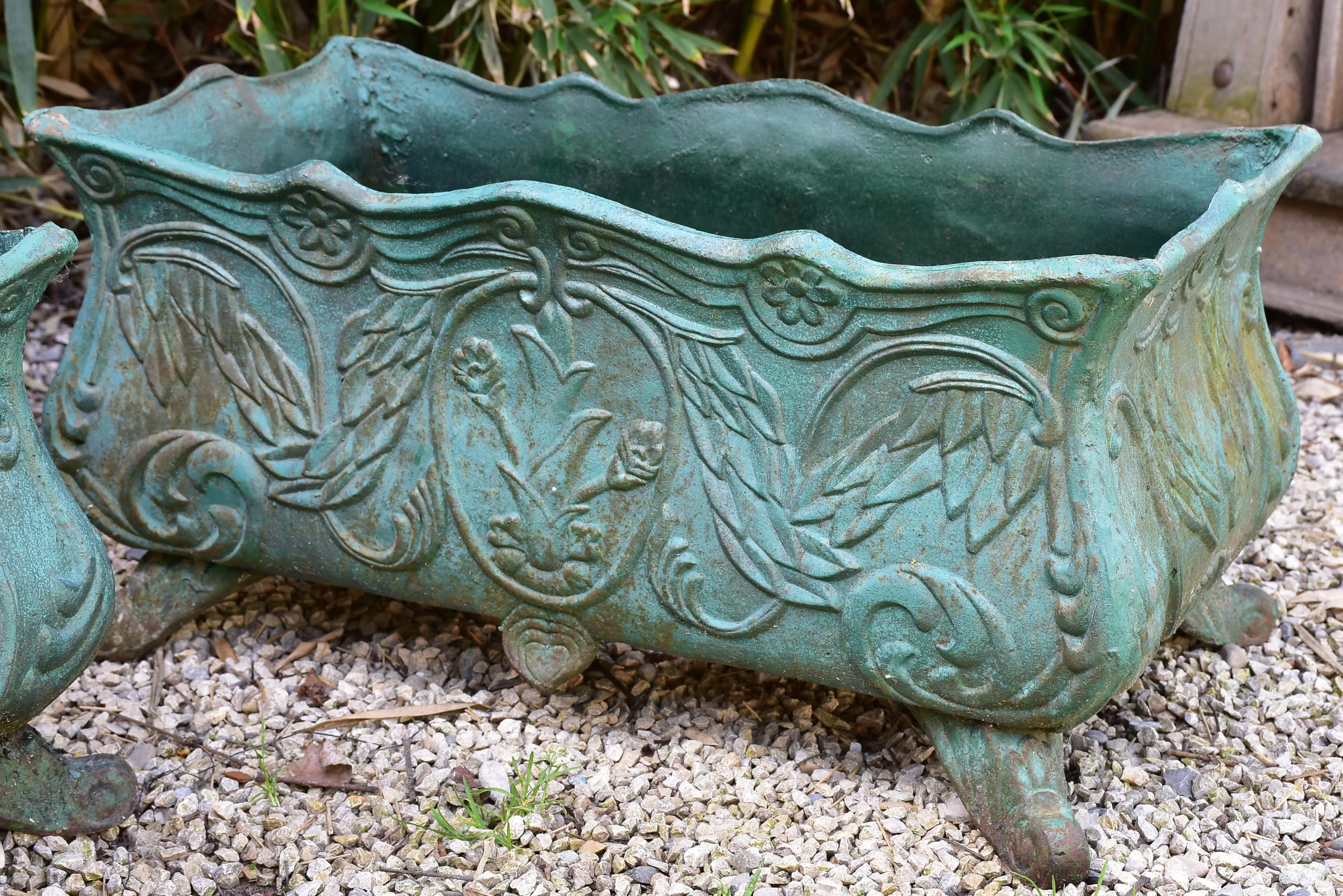 Two antique cast iron French garden planters with green finish
